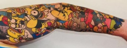 Мировой рекорд по количеству татуировок с мультяшным персонажем (7 фото)